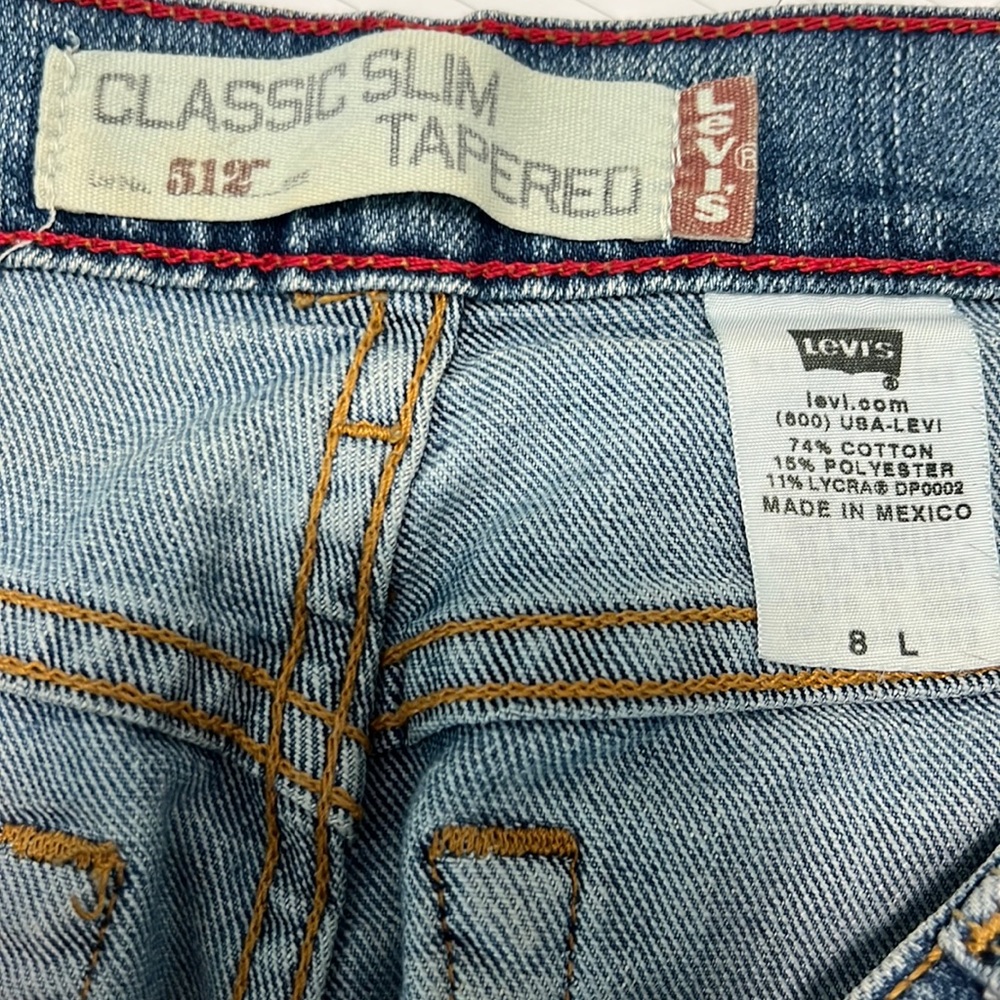 Levi Classic Slim 512 5 pocket tapered jeans. Inseam measures 30”.